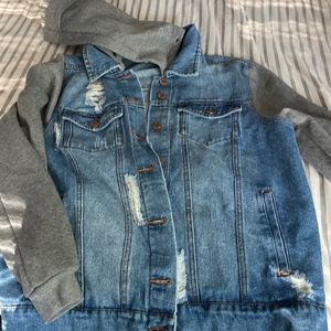 Distressed Trucker denim jacket with sweatshirt sleeves and detachable hood